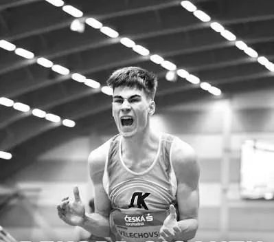 Czech sprinter celebrating indoors